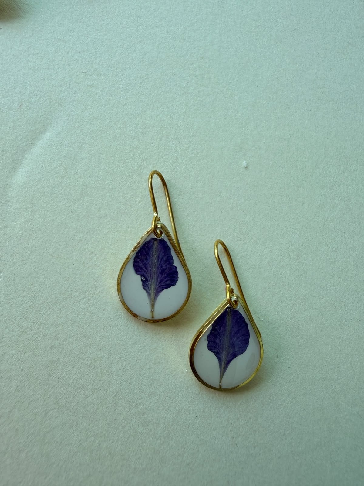 Pressed purple leaf earrings set in clear resin